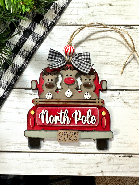 North pole reindeer truck ornament